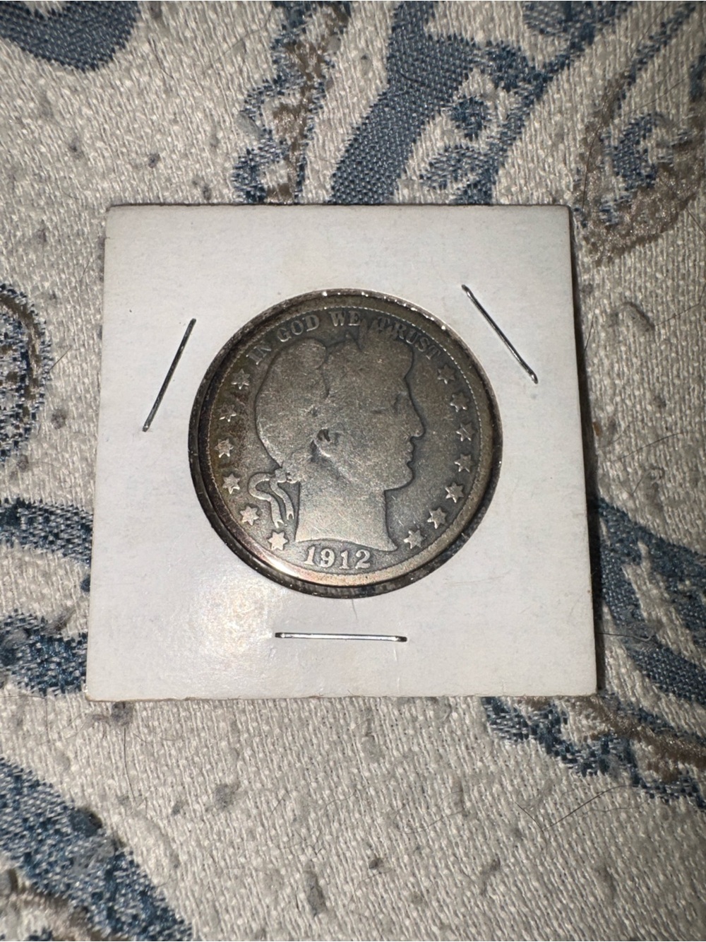 This is a 1912 Barber Half Dollar, designed by Charles E. Barber and struck in 9